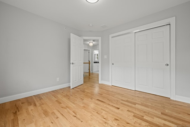 54 Edgerton Rd, Granby, CT 06090 - unfurnished bedroom with light wood-style floors and a closet
