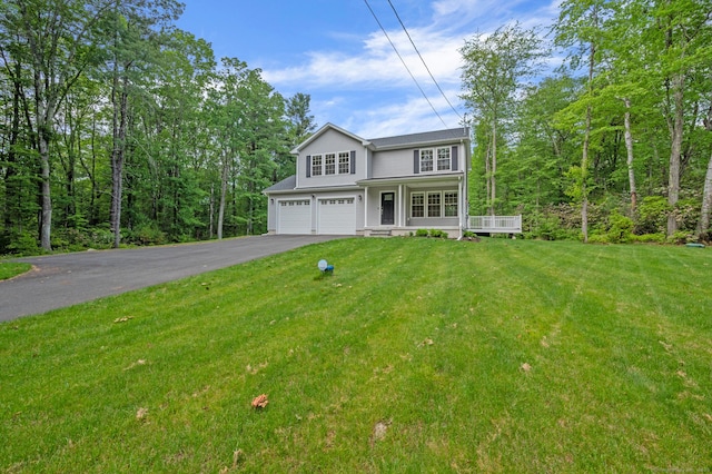 54 Edgerton Rd, Granby, CT 06090 - traditional-style home featuring an attached garage, driveway, and a front lawn