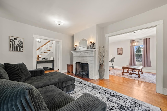 16 Academy St, Manchester, CT 06040 - living area featuring baseboards, wood finished floors, and stairs