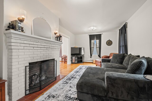 16 Academy St, Manchester, CT 06040 - living area featuring a fireplace and wood finished floors