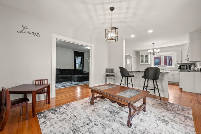 16 Academy St, Manchester, CT 06040 - living room with a chandelier, plenty of natural light, light wood finished floors, and recessed lighting