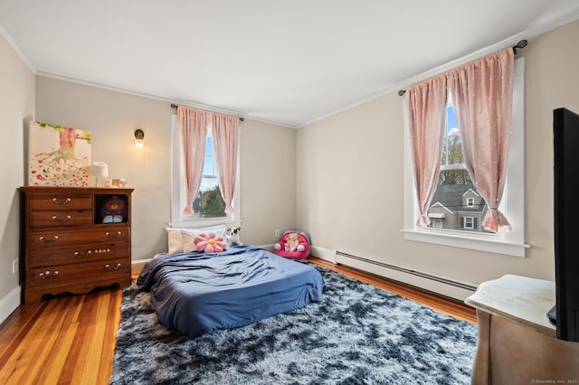 16 Academy St, Manchester, CT 06040 - bedroom featuring wood finished floors, crown molding, and baseboard heating