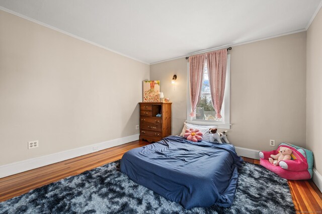 16 Academy St, Manchester, CT 06040 - bedroom with baseboards, wood finished floors, and crown molding
