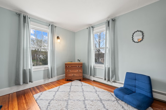 16 Academy St, Manchester, CT 06040 - sitting room with a baseboard heating unit, hardwood / wood-style flooring, and crown molding