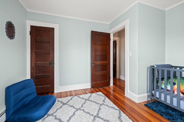 16 Academy St, Manchester, CT 06040 - bedroom with hardwood / wood-style flooring, baseboards, and ornamental molding