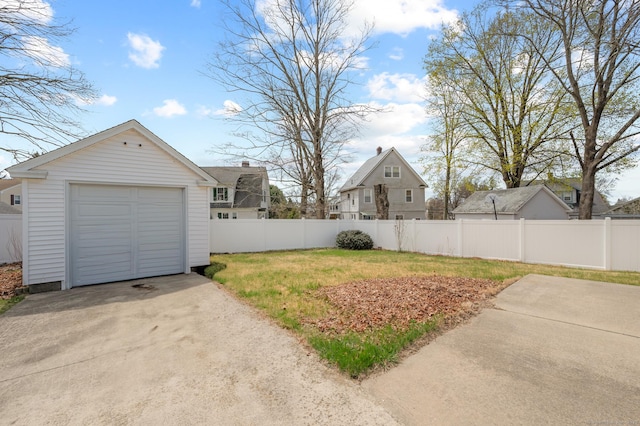 16 Academy St, Manchester, CT 06040 - view of yard featuring an outdoor structure, driveway, fence, and a garage