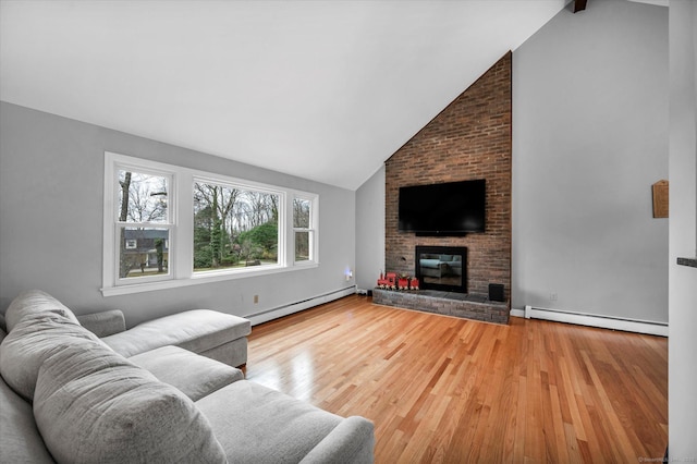 394 Woodhaven Rd, Glastonbury, CT 06033 - living room featuring a brick fireplace, wood finished floors, high vaulted ceiling, and a baseboard radiator