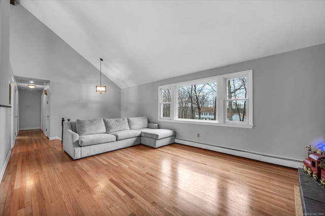 394 Woodhaven Rd, Glastonbury, CT 06033 - living room with a baseboard radiator, lofted ceiling, wood finished floors, and baseboards