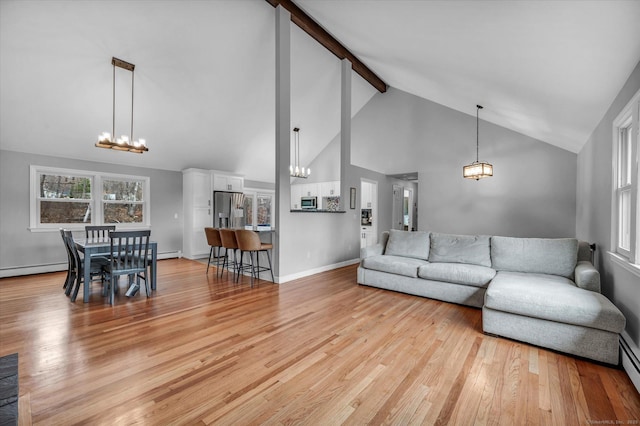 394 Woodhaven Rd, Glastonbury, CT 06033 - living area featuring beamed ceiling, light wood-style floors, high vaulted ceiling, and a notable chandelier