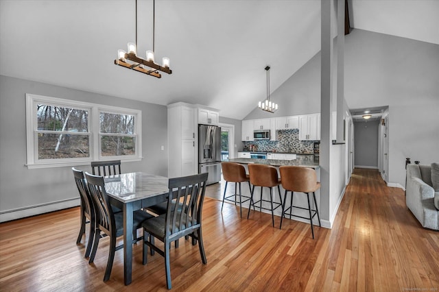 394 Woodhaven Rd, Glastonbury, CT 06033 - dining space with beamed ceiling, a healthy amount of sunlight, high vaulted ceiling, and a notable chandelier