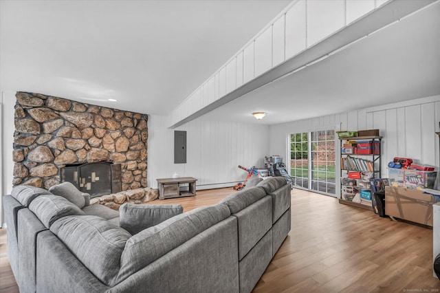 394 Woodhaven Rd, Glastonbury, CT 06033 - living room featuring electric panel, wood finished floors, a fireplace, and a decorative wall
