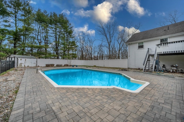394 Woodhaven Rd, Glastonbury, CT 06033 - view of pool featuring stairway, a patio area, a fenced backyard, a fenced in pool, and a wooden deck