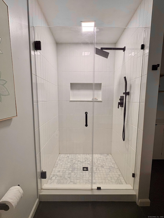 64 Sherwood Ln, Norwich, CT 06360 - full bathroom featuring a stall shower and baseboards