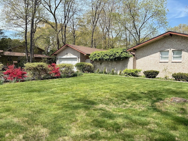 64 Sherwood Ln, Norwich, CT 06360 - single story home featuring brick siding, a front lawn, and an attached garage