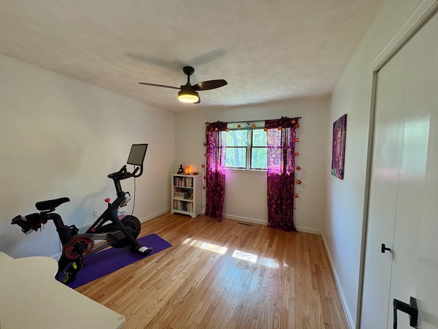 64 Sherwood Ln, Norwich, CT 06360 - exercise area with baseboards, light wood-style floors, and a ceiling fan