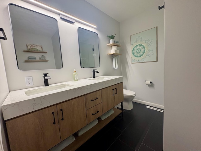 64 Sherwood Ln, Norwich, CT 06360 - bathroom with toilet, visible vents, double vanity, and a sink