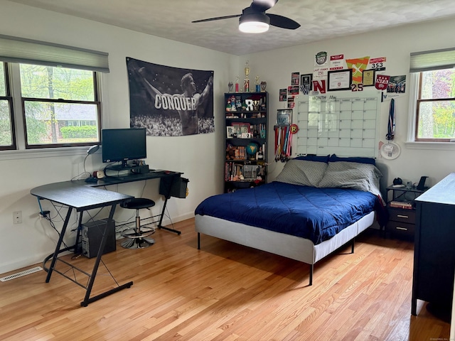 64 Sherwood Ln, Norwich, CT 06360 - bedroom with ceiling fan, baseboards, visible vents, and wood finished floors