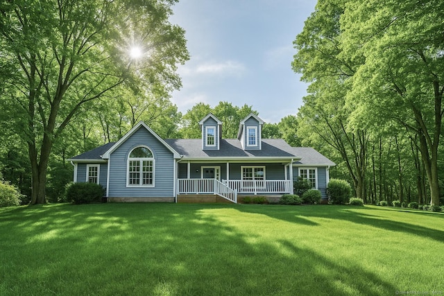 back of property featuring a lawn and covered porch