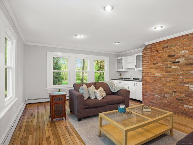 44 Buckingham Ridge Rd, Wilton, CT 06897 - living room featuring a baseboard heating unit, light wood-style floors, brick wall, ornamental molding, and recessed lighting