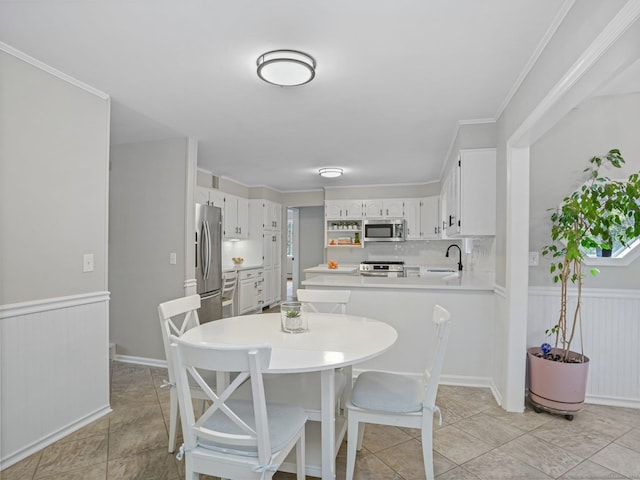 44 Buckingham Ridge Rd, Wilton, CT 06897 - dining space featuring a wainscoted wall and crown molding