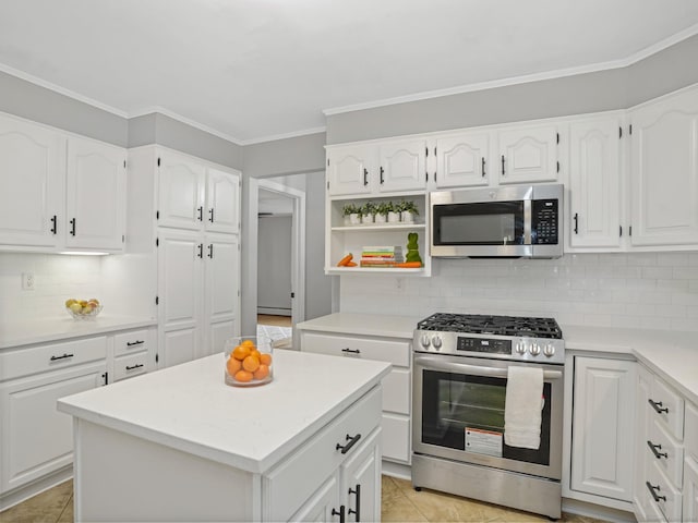 44 Buckingham Ridge Rd, Wilton, CT 06897 - kitchen with stainless steel appliances, decorative backsplash, white cabinets, and ornamental molding