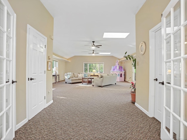 44 Buckingham Ridge Rd, Wilton, CT 06897 - hallway featuring carpet, a skylight, baseboards, vaulted ceiling, and french doors