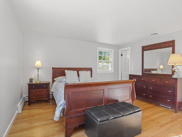 44 Buckingham Ridge Rd, Wilton, CT 06897 - bedroom featuring light wood-style floors, a baseboard radiator, and a baseboard heating unit