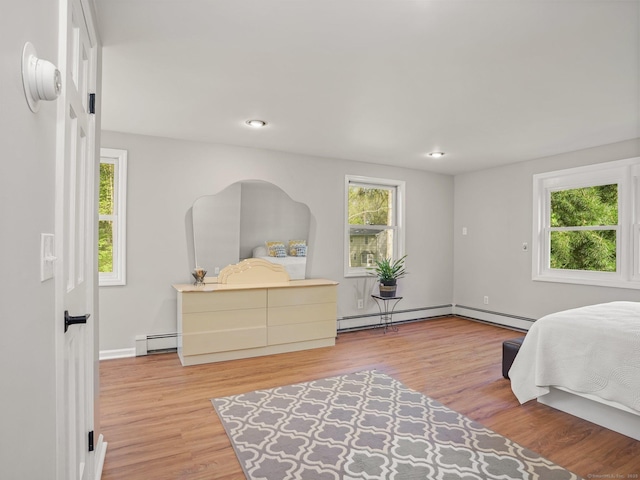 44 Buckingham Ridge Rd, Wilton, CT 06897 - bedroom featuring a baseboard radiator, multiple windows, wood finished floors, and recessed lighting