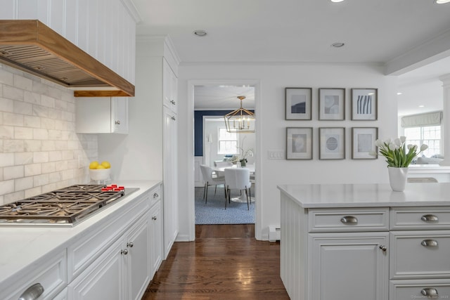 kitchen featuring white cabinets, dark wood-style flooring, custom exhaust hood, and stainless steel gas cooktop
