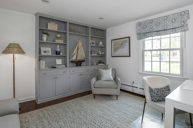 sitting room with a baseboard radiator, recessed lighting, and wood finished floors
