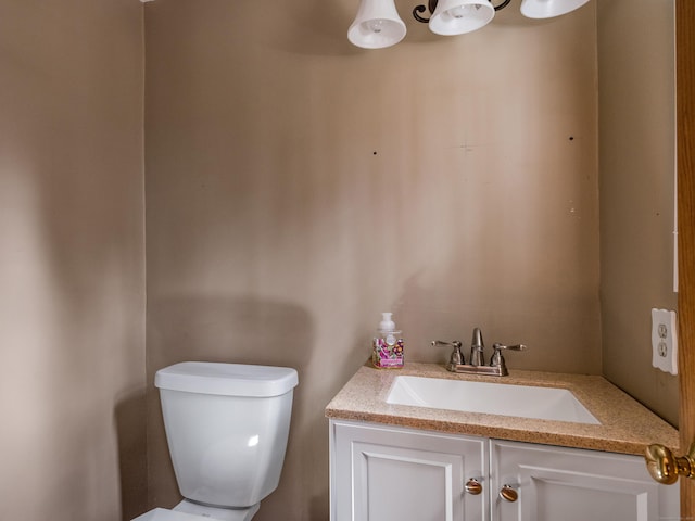 bathroom with toilet and vanity