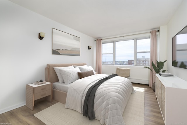 65 Glenbrook Rd Apt 6B, Stamford, CT 06902 - bedroom with light wood-style flooring and baseboards