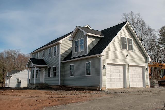 view of side of home with roof with shingles