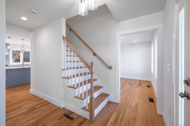 896 E St, Middletown, CT 06457 - staircase with wood finished floors, a chandelier, and recessed lighting