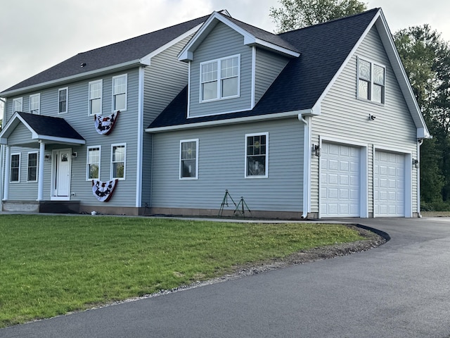 896 E St, Middletown, CT 06457 - view of front facade with a garage, a front yard, and asphalt driveway
