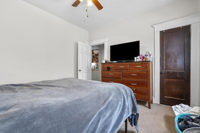 bedroom featuring light colored carpet and ceiling fan