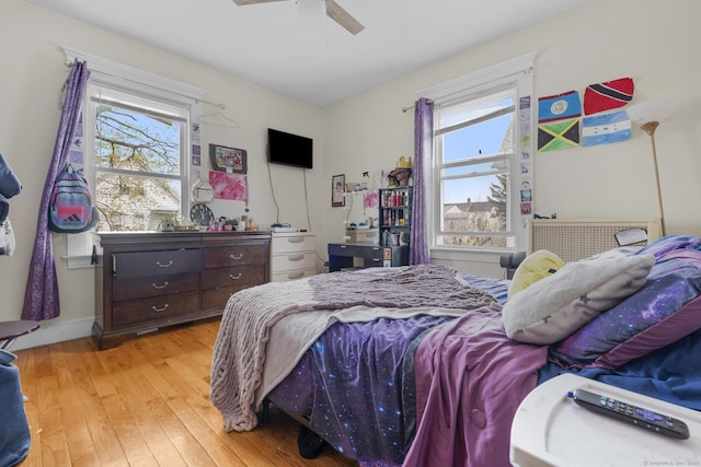 bedroom featuring light wood finished floors and ceiling fan