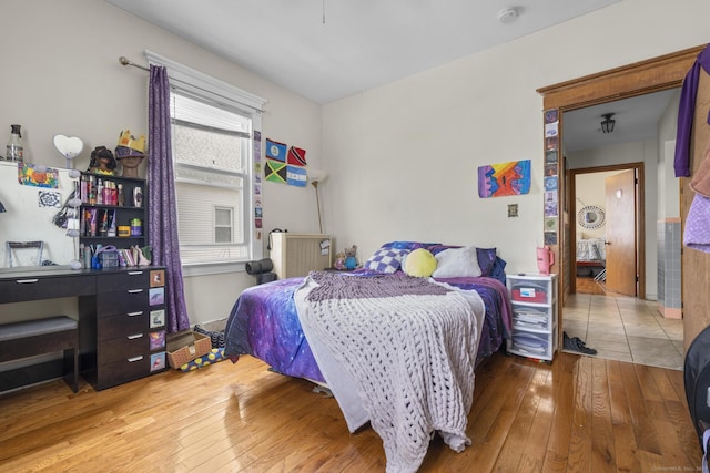 bedroom with hardwood / wood-style flooring