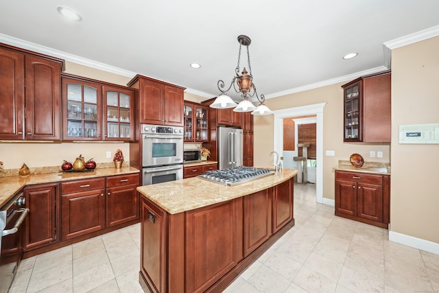 kitchen featuring a center island with sink, decorative light fixtures, light stone counters, ornamental molding, and appliances with stainless steel finishes