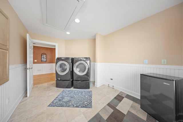 washroom featuring attic access, a wainscoted wall, recessed lighting, washer and dryer, and laundry area