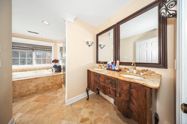 full bathroom featuring a bath, baseboards, a sink, and double vanity