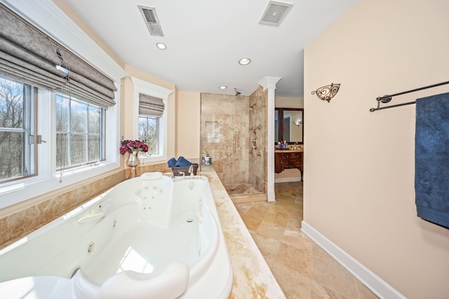 bathroom featuring a shower stall, visible vents, a jetted tub, and decorative columns