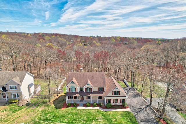 aerial view with a wooded view