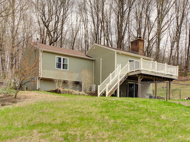10 Versailles Rd, Lisbon, CT 06351 - rear view of house with stairway, a lawn, fence, and a deck