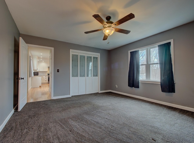 10 Versailles Rd, Lisbon, CT 06351 - unfurnished bedroom with a closet, baseboards, a ceiling fan, and carpet