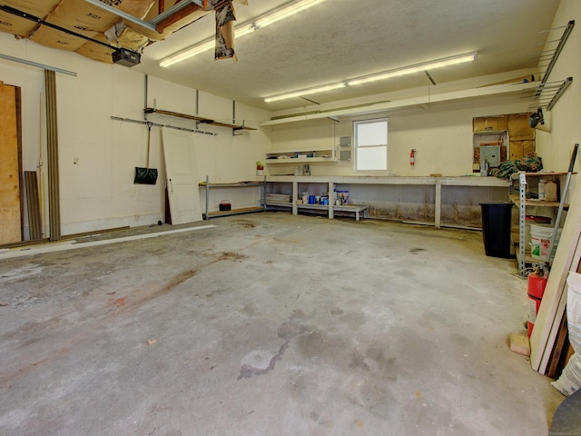 10 Versailles Rd, Lisbon, CT 06351 - garage featuring a workshop area and a garage door opener
