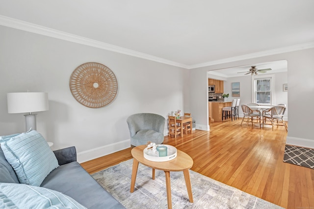 435 Lenox Rd, Fairfield, CT 06825 - living area featuring light wood-style flooring, baseboards, ornamental molding, and a ceiling fan