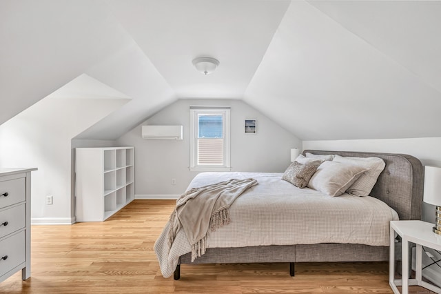 435 Lenox Rd, Fairfield, CT 06825 - bedroom featuring light wood-type flooring, a wall mounted air conditioner, vaulted ceiling, and baseboards