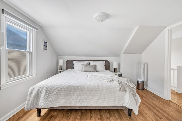 435 Lenox Rd, Fairfield, CT 06825 - bedroom with baseboards, vaulted ceiling, and wood finished floors