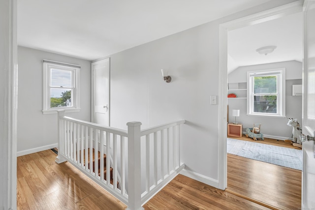 435 Lenox Rd, Fairfield, CT 06825 - hall with an upstairs landing, wood finished floors, baseboards, and vaulted ceiling